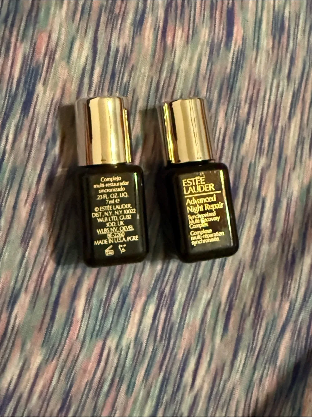 Estee Lauder Night Repair Serum Bottles in Black and Gold